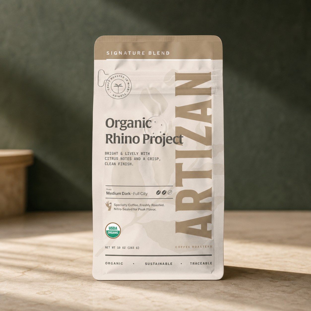 Artizan Organic Rhino Project coffee bag on limestone counter
